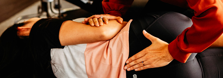 Chiropractor Fullerton CA Paris de Grasse Adjusting Patient Chiropractor Fullerton CA Paris de Grasse Adjusting Patient